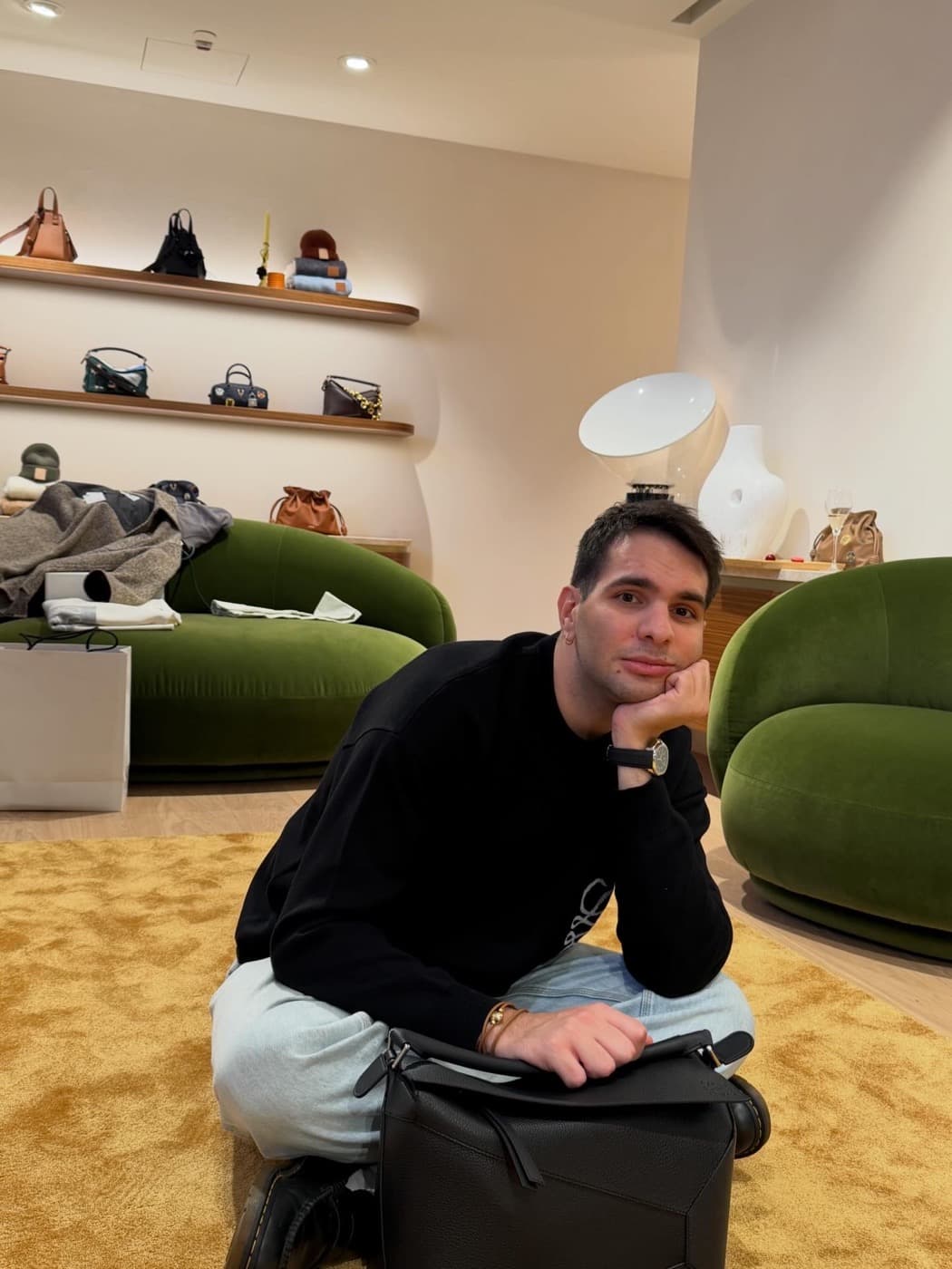 Federico sitting in a fashion boutique interior